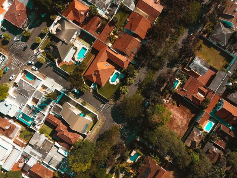 Aerial view of a cluster of homes among trees