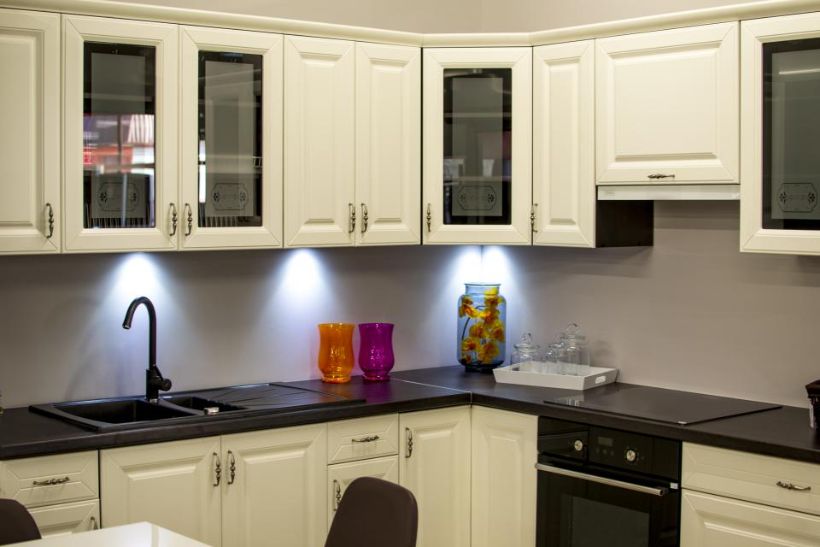 Kitchen with cream cabinetry and under-cabinet lighting