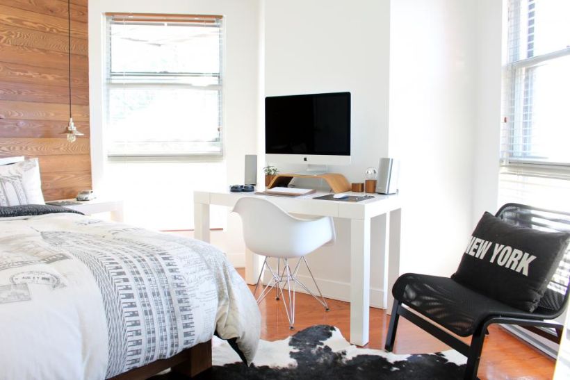 Bright new bedroom with a desk by the windows