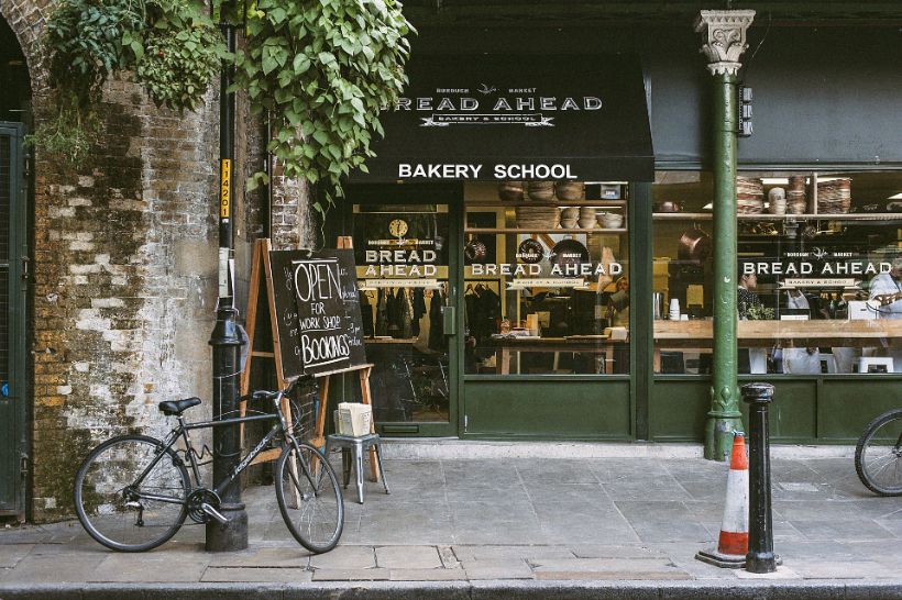 Glazed shopfront on a tree-lined street