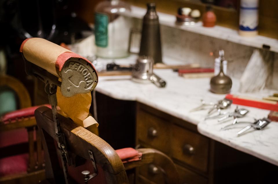 Barbershop station with a leather chair and grooming tools