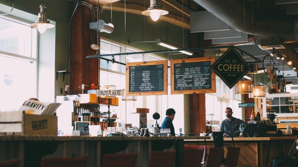 Coffee shop service counter with chalkboard menus