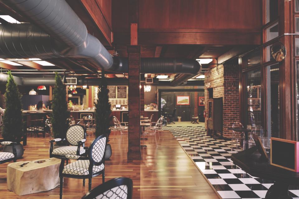 Restaurant interior with timber floors and exposed ductwork